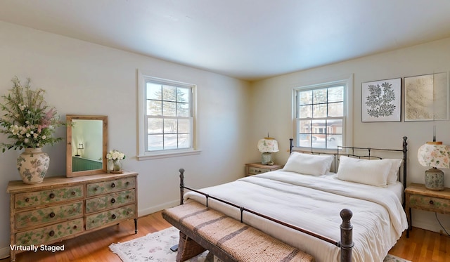 bedroom with hardwood / wood-style flooring