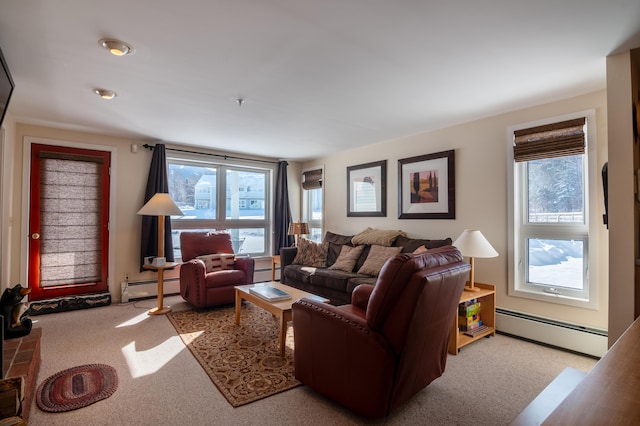 carpeted living room featuring a baseboard radiator and plenty of natural light