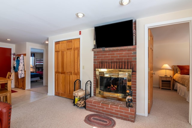 carpeted living room featuring a brick fireplace