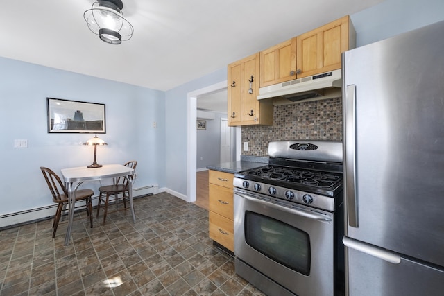 kitchen with light brown cabinets, under cabinet range hood, baseboards, appliances with stainless steel finishes, and decorative backsplash