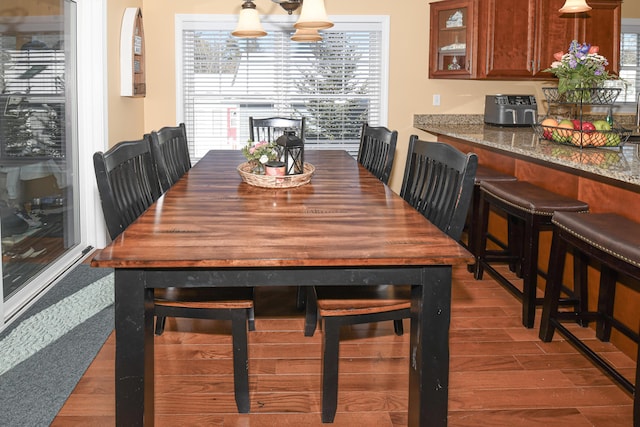 dining room featuring dark wood finished floors and a notable chandelier