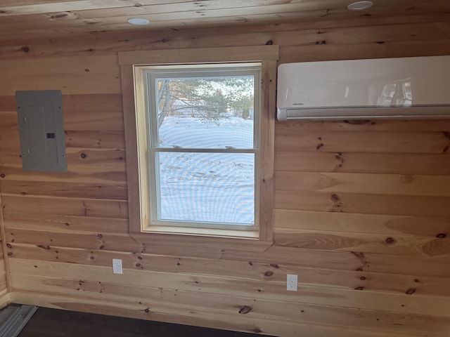 details featuring a wall mounted AC, electric panel, and wooden walls