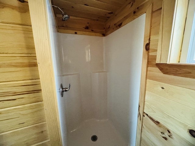 bathroom featuring wooden ceiling and a shower