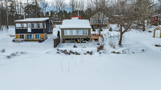 view of snow covered house