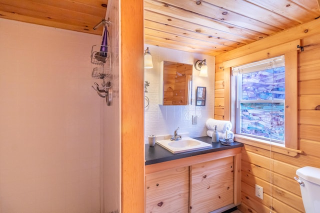 bathroom featuring vanity, decorative backsplash, wooden ceiling, and toilet