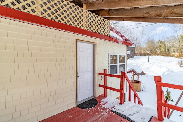 view of snow covered property entrance