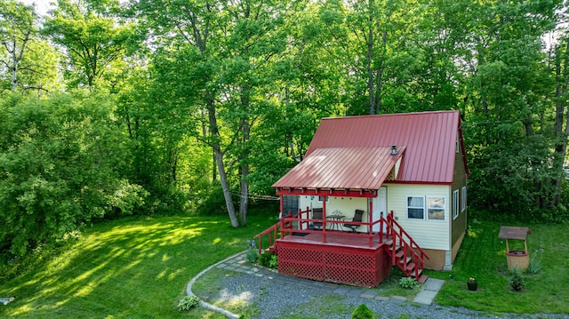 2AND3 Blue Heron Ln, Winslow, ME 04901 - rear view of property featuring a lawn, a metal roof, a wooden deck, and a view of trees