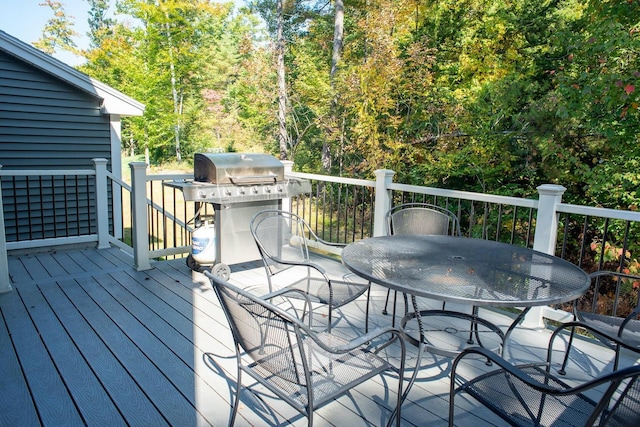 wooden deck featuring area for grilling