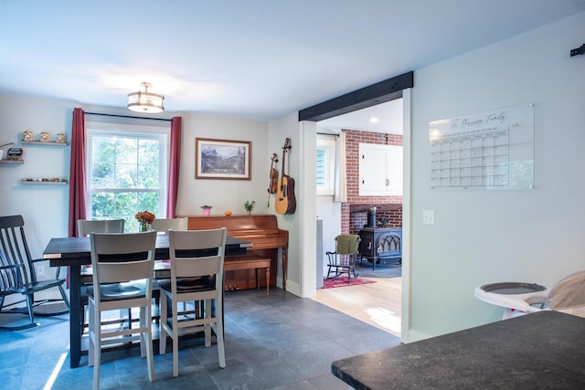 dining space with a wood stove