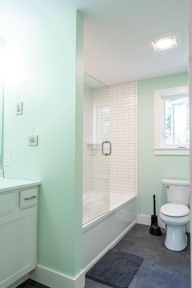 full bathroom with vanity, toilet, tile patterned flooring, and combined bath / shower with glass door