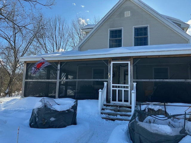 view of front facade featuring a sunroom