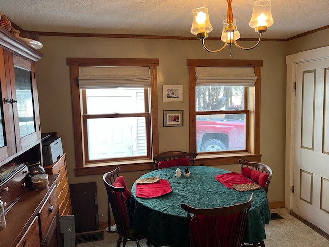 dining space with visible vents, light colored carpet, crown molding, a textured ceiling, and a notable chandelier