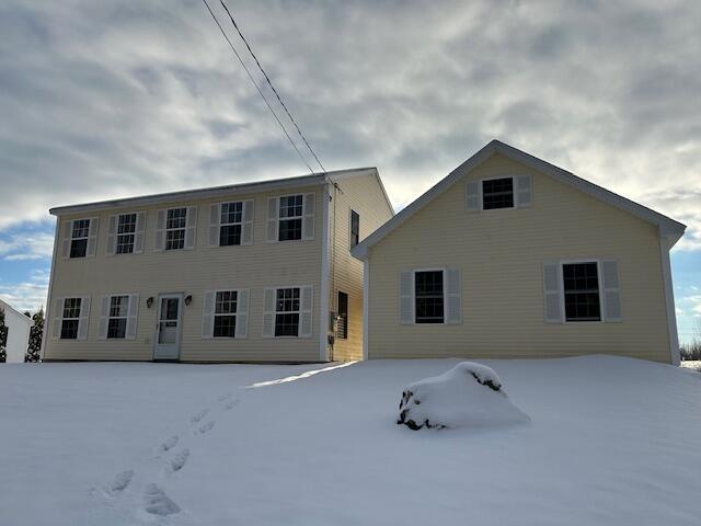 view of snow covered property