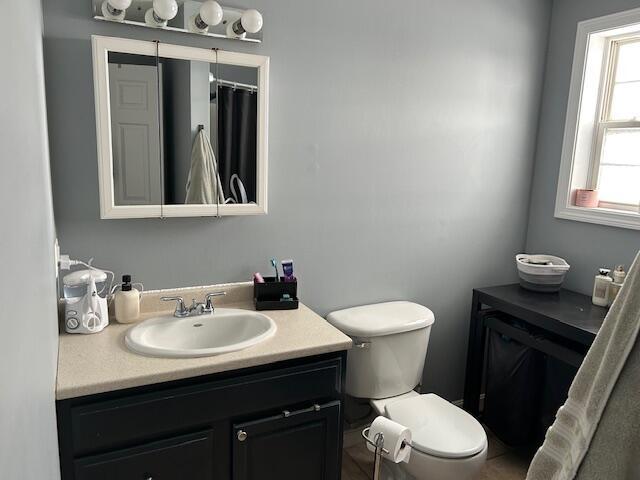 bathroom with vanity and toilet