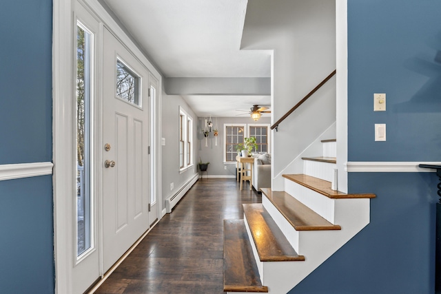 entryway with dark wood-type flooring and baseboard heating