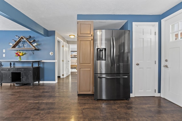 kitchen featuring light brown cabinets, dark hardwood / wood-style floors, a textured ceiling, and stainless steel refrigerator with ice dispenser