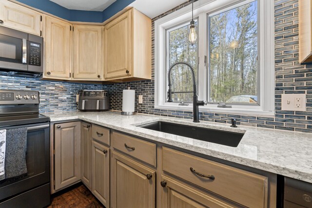 kitchen with sink, backsplash, light stone countertops, black range with electric cooktop, and light brown cabinets