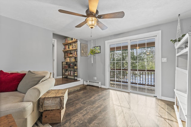 unfurnished room featuring dark wood-type flooring, a baseboard radiator, ceiling fan, and a textured ceiling