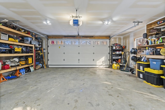 garage featuring a garage door opener and a baseboard radiator