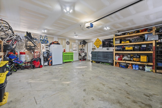 garage featuring a garage door opener and white fridge