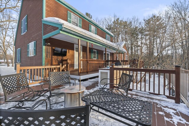 view of snow covered deck