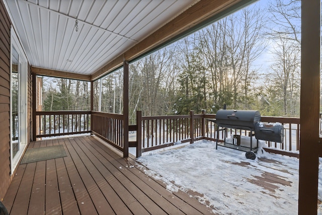 snow covered deck with grilling area