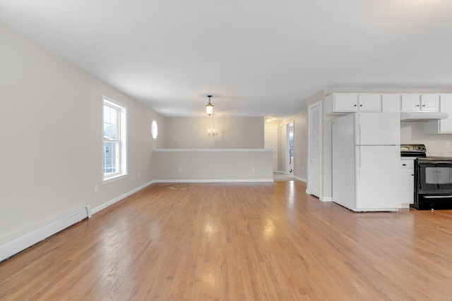 unfurnished living room with light hardwood / wood-style flooring, a notable chandelier, and a baseboard radiator