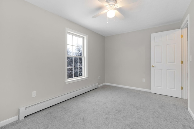 unfurnished room with baseboard heating, light colored carpet, and ceiling fan