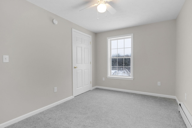 carpeted empty room with baseboard heating and ceiling fan