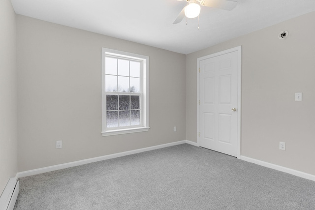 unfurnished room with carpet, ceiling fan, and baseboard heating