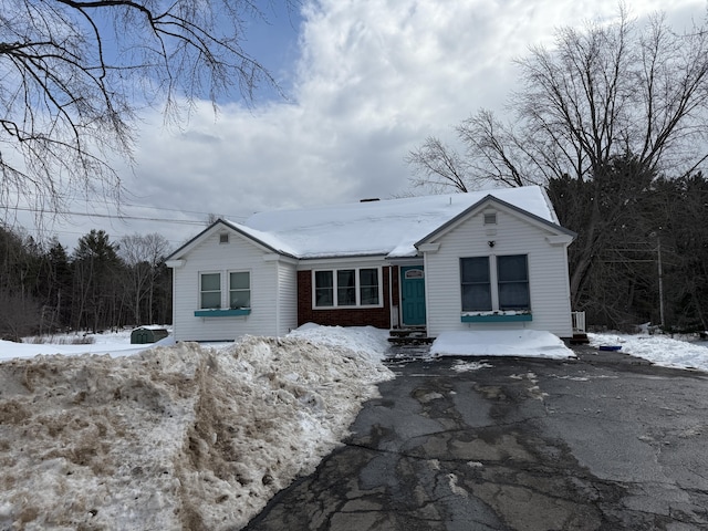 view of front of house featuring brick siding