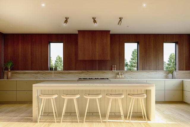 kitchen featuring white cabinetry and a kitchen breakfast bar