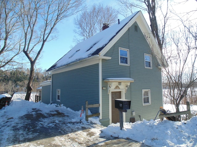 exterior space featuring a chimney