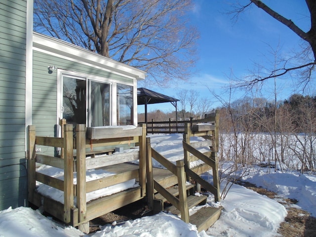 view of snow covered deck