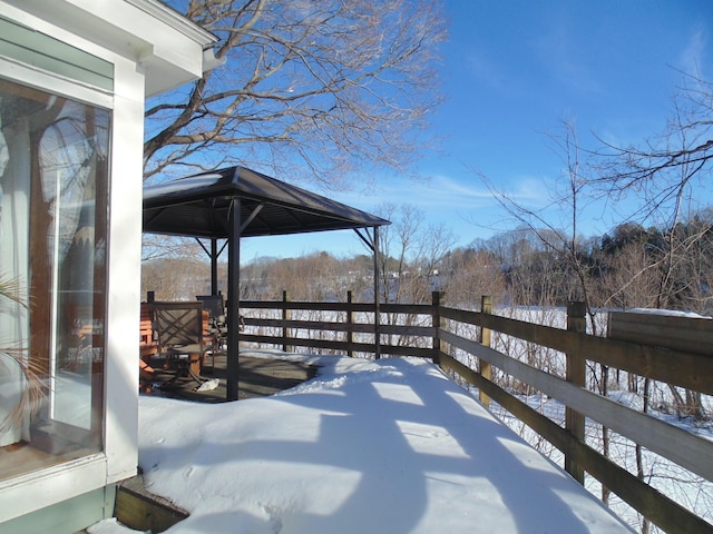 snow covered deck featuring a gazebo