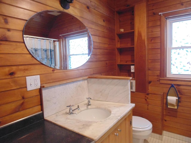 full bath featuring wood walls and a wealth of natural light