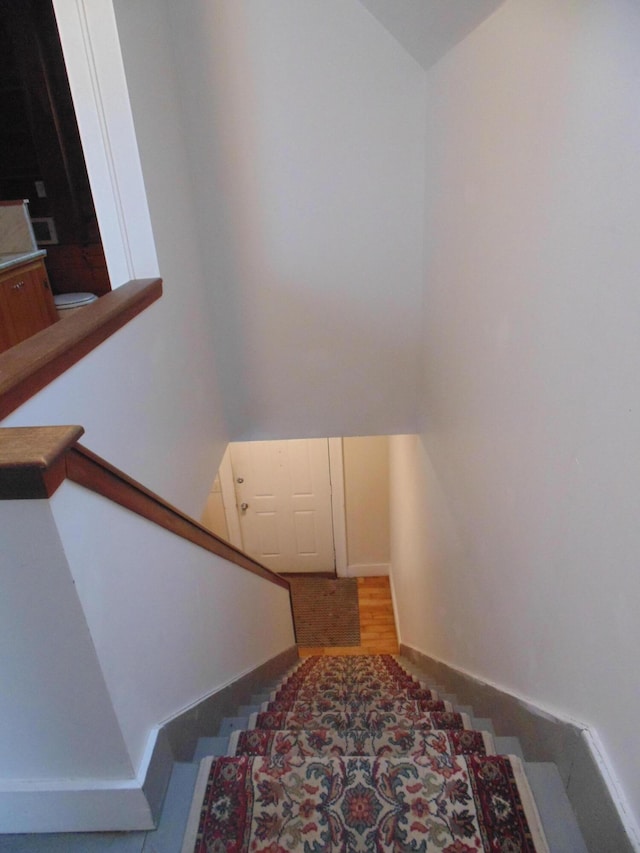 stairs featuring baseboards