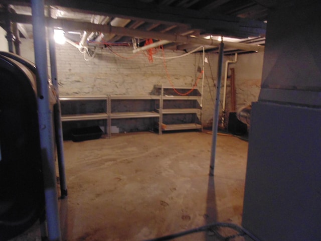 unfinished basement with heating fuel and heating unit