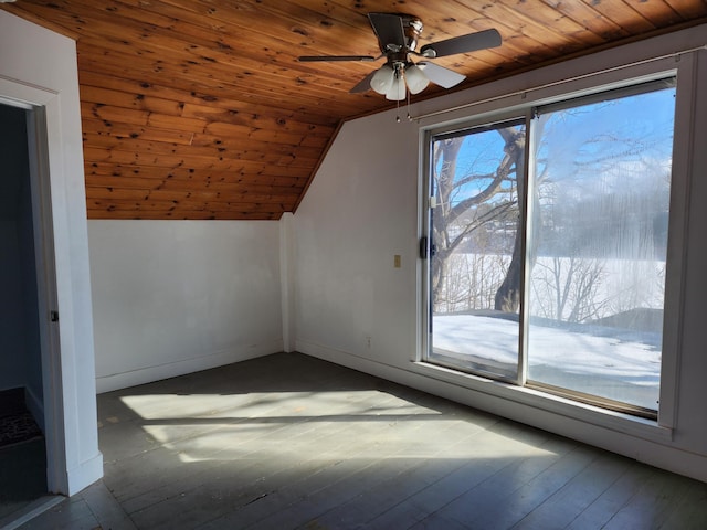 additional living space featuring baseboards, a ceiling fan, wooden ceiling, wood-type flooring, and vaulted ceiling