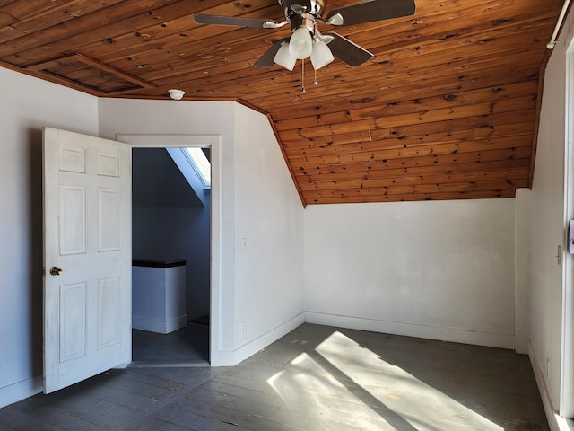 additional living space with wooden ceiling, vaulted ceiling, and baseboards