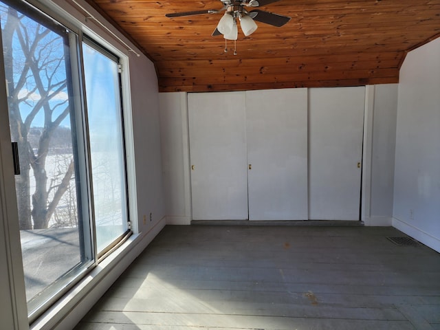 interior space featuring lofted ceiling, a healthy amount of sunlight, and wood ceiling