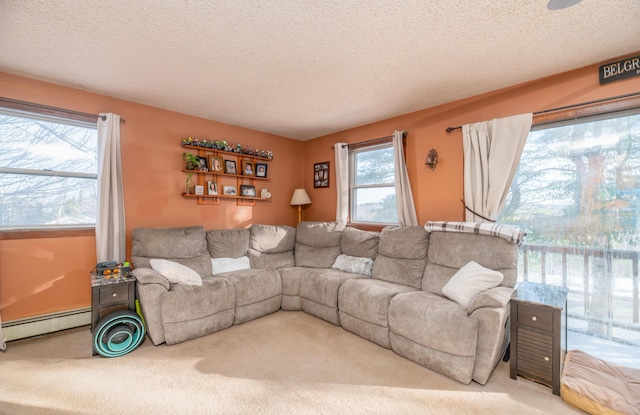 carpeted living room with a baseboard heating unit and a textured ceiling