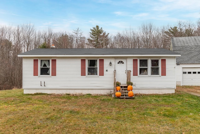 view of front facade featuring a garage and a front yard