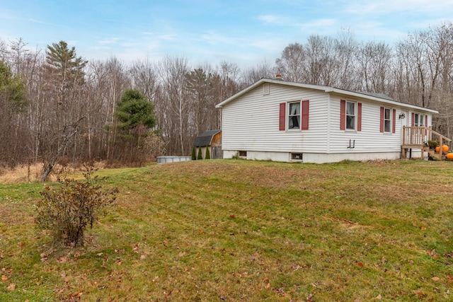 view of home's exterior with a yard