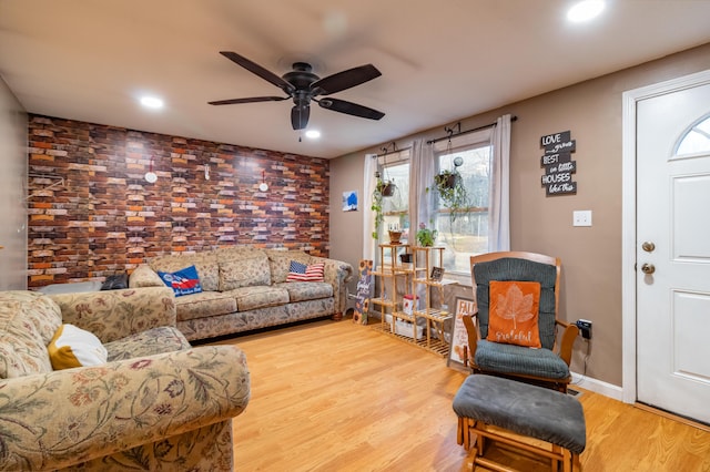 living room with ceiling fan and wood-type flooring