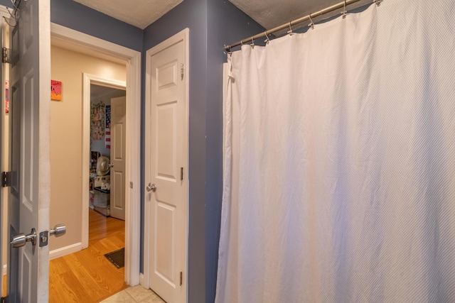 bathroom featuring hardwood / wood-style flooring