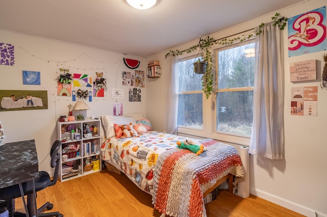 bedroom with light wood-type flooring