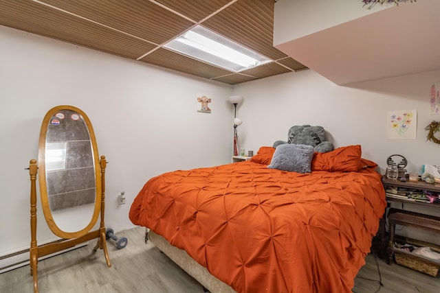 bedroom with hardwood / wood-style floors