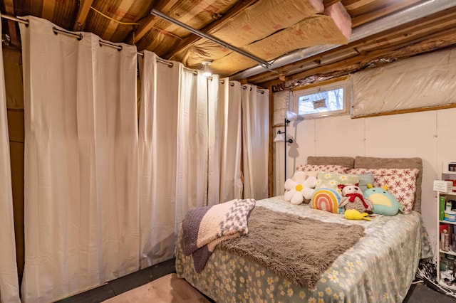 bedroom featuring concrete flooring