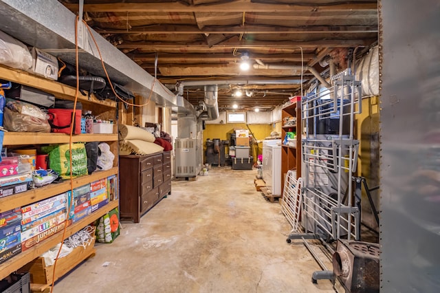 basement with washer / clothes dryer and heating unit